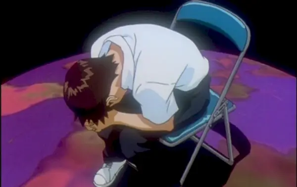 Shinji se dobló en una silla en End of Evangelion.