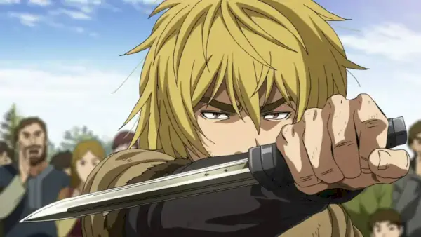 Thorfinn sosteniendo un cuchillo