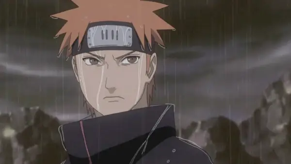 Yahiko frunce el ceño bajo la lluvia en