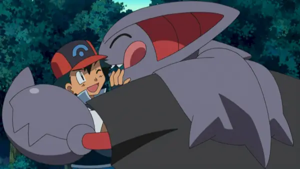 Gliscor dando um grande abraço em Ash Ketchum