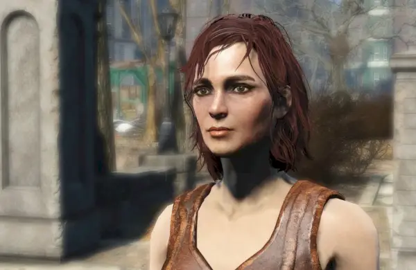 Cait steht draußen und trägt ein braunes Oberteil (Bethesda)