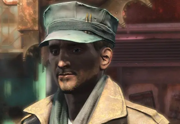 Macready bär en hatt med två kulor instoppade i kanten (Bethesda)