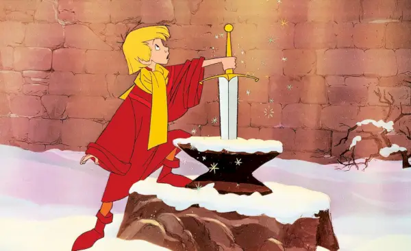 Tânărul rege Arthur scoțând sabia din piatră în The Sword in the Stone