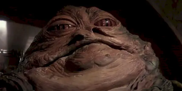 Jabba the Hutt olhando ameaçadoramente para dentro